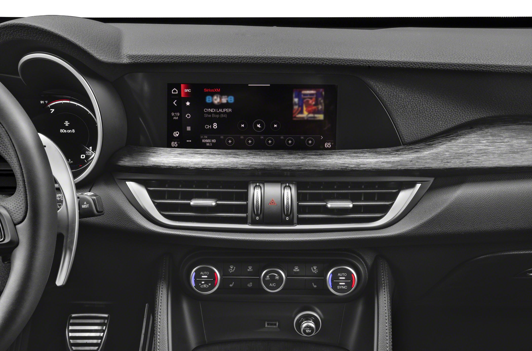 Dashboard and infotainment screen with climate control knobs