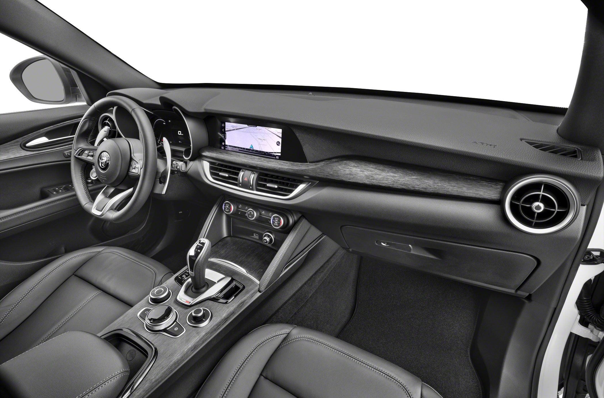 Modern car interior with digital display, steering wheel controls, and gear shifter.