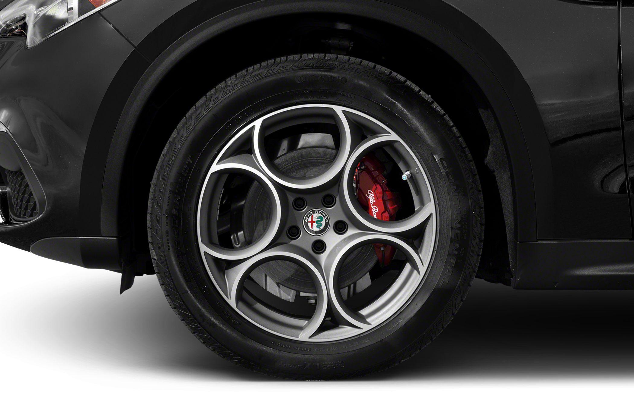 Close-up of multi-spoke alloy wheel with red brake caliper