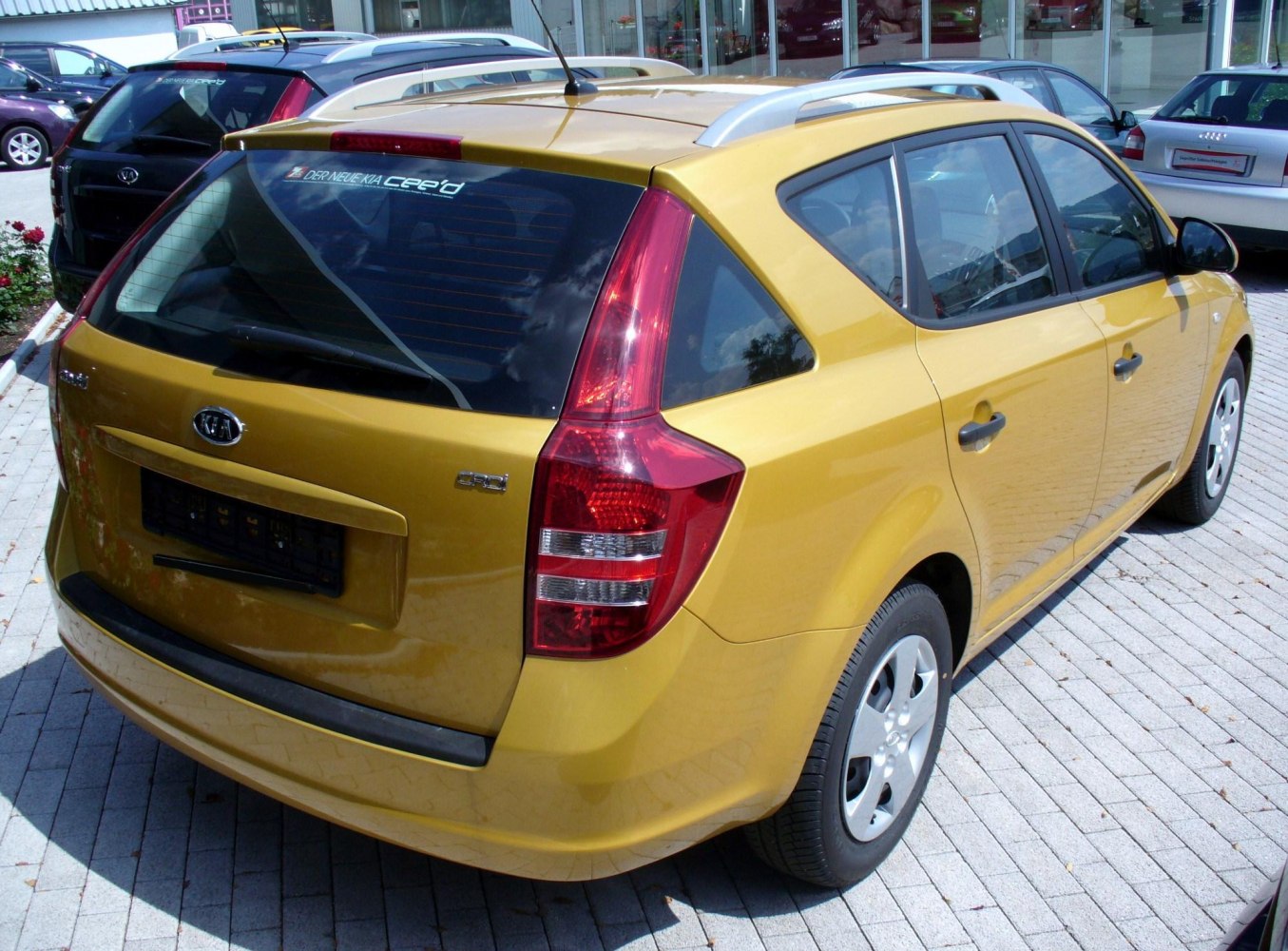Rear view of station wagon with roof rails and vertical tail lights