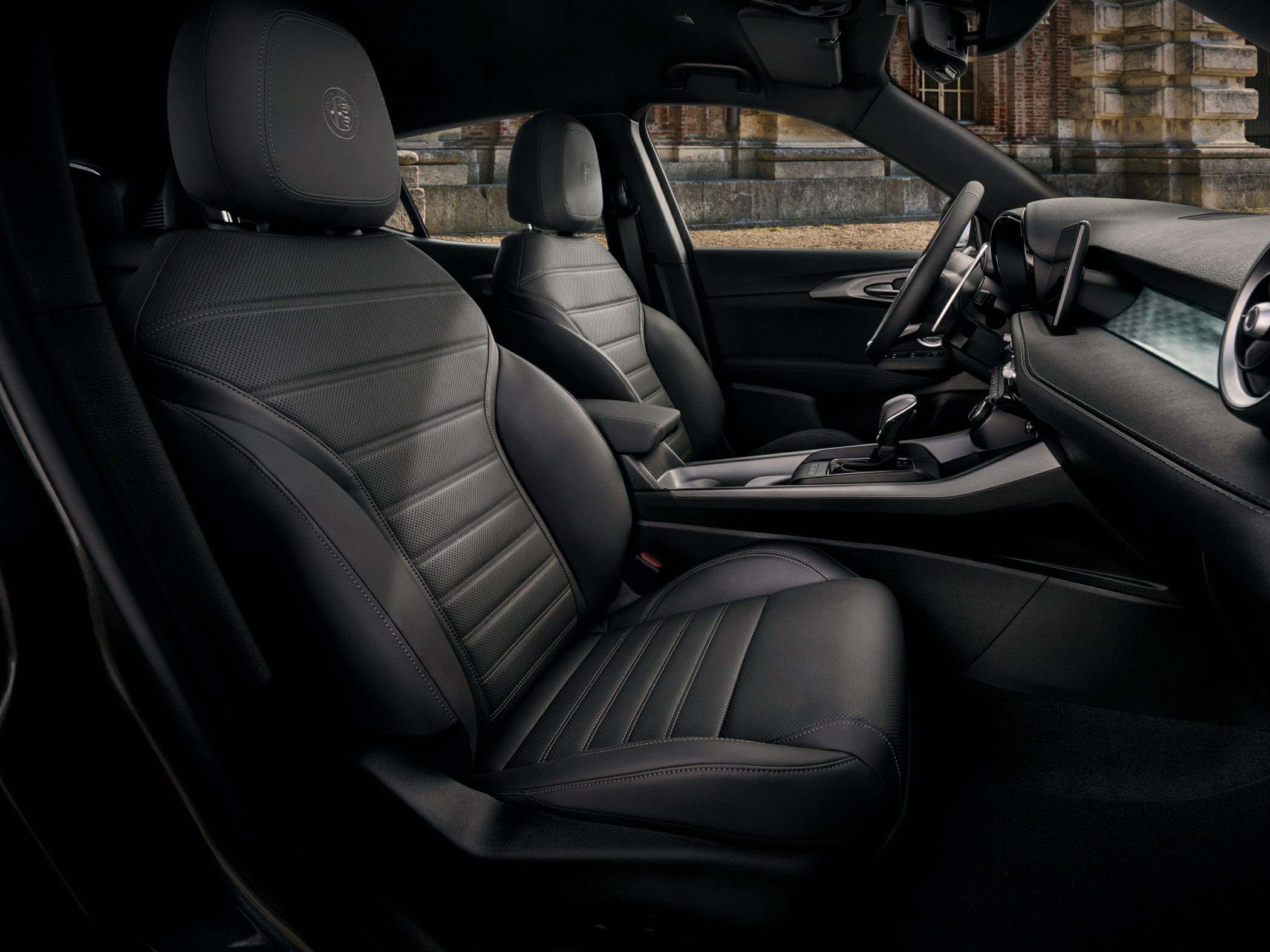 Premium black leather front seats with modern dashboard and console