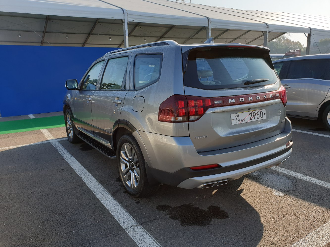 Rear view of an SUV with 4WD badge and dual exhaust pipes