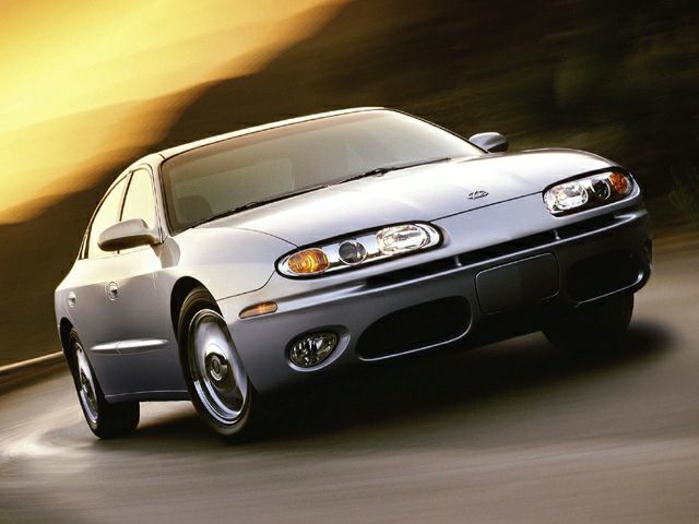 Sleek dual front headlights and aerodynamic, smooth sedan body design