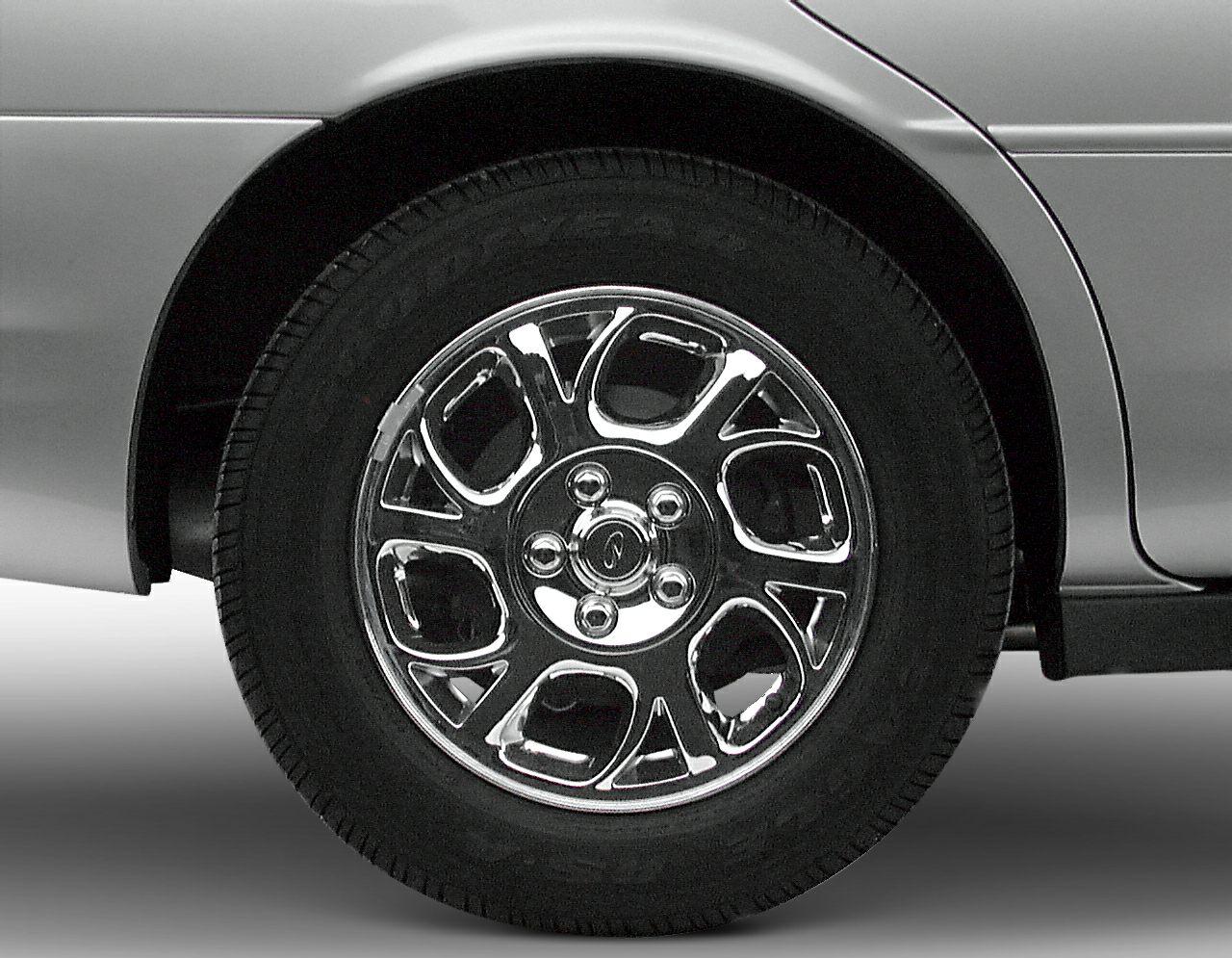 Chrome alloy wheel with distinctive multi-spoke design and black tire tread