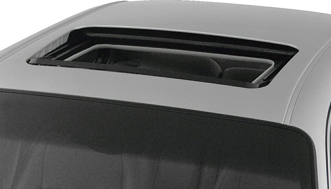 Open sunroof on a car roof with visible interior headrest