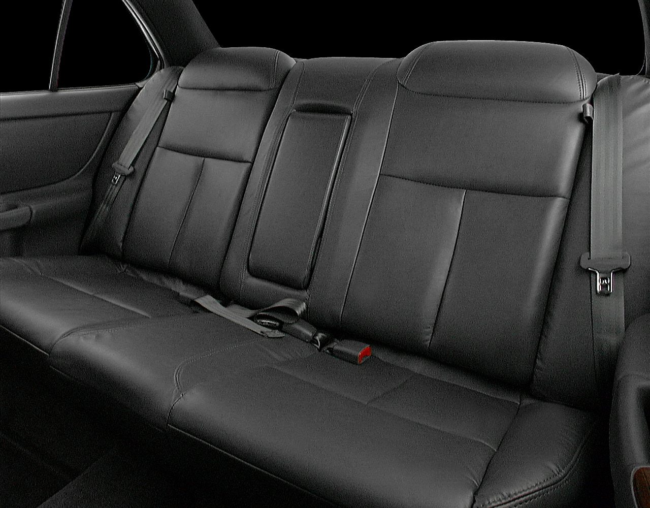 Black leather rear seat with integrated seat belts and headrests