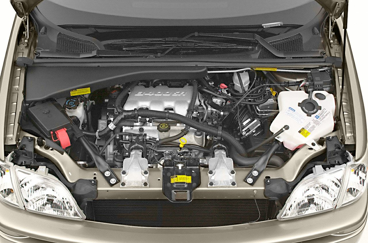 Engine bay with visible mechanical components and headlights