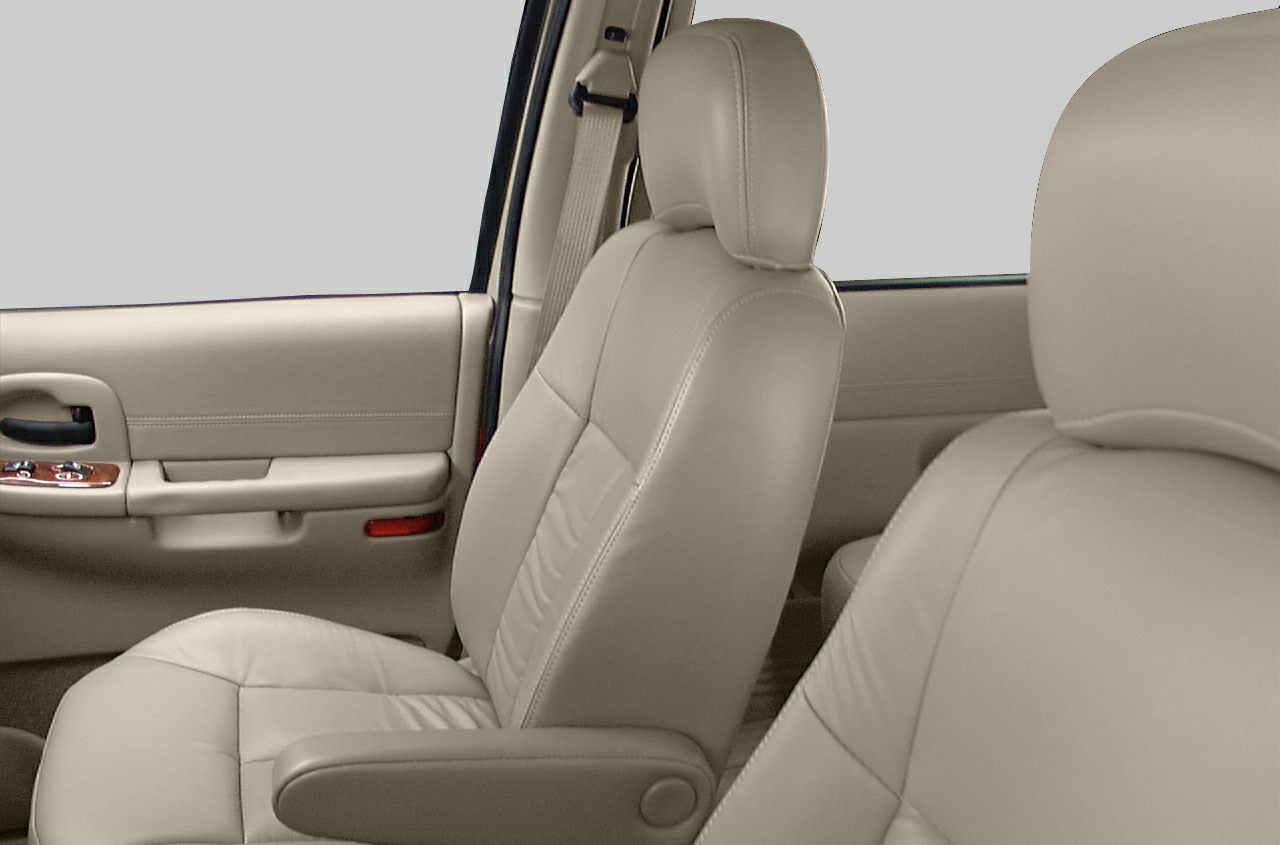 Beige leather front seats and door panel with controls