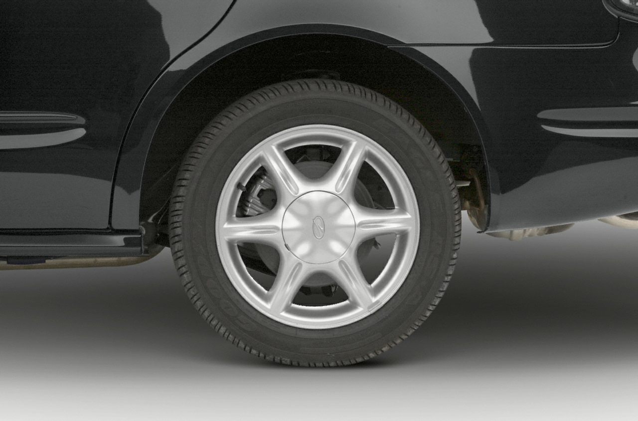 Close-up of a five-spoke alloy wheel on a black vehicle