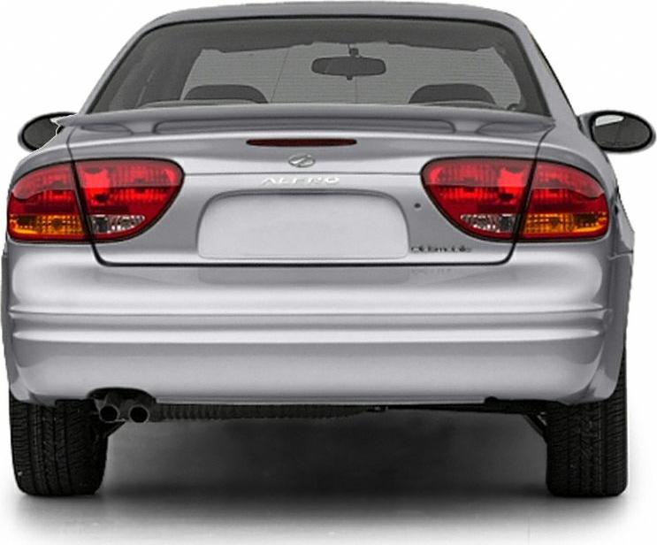 Rear view with distinctive tail lights, dual exhaust, and trunk design