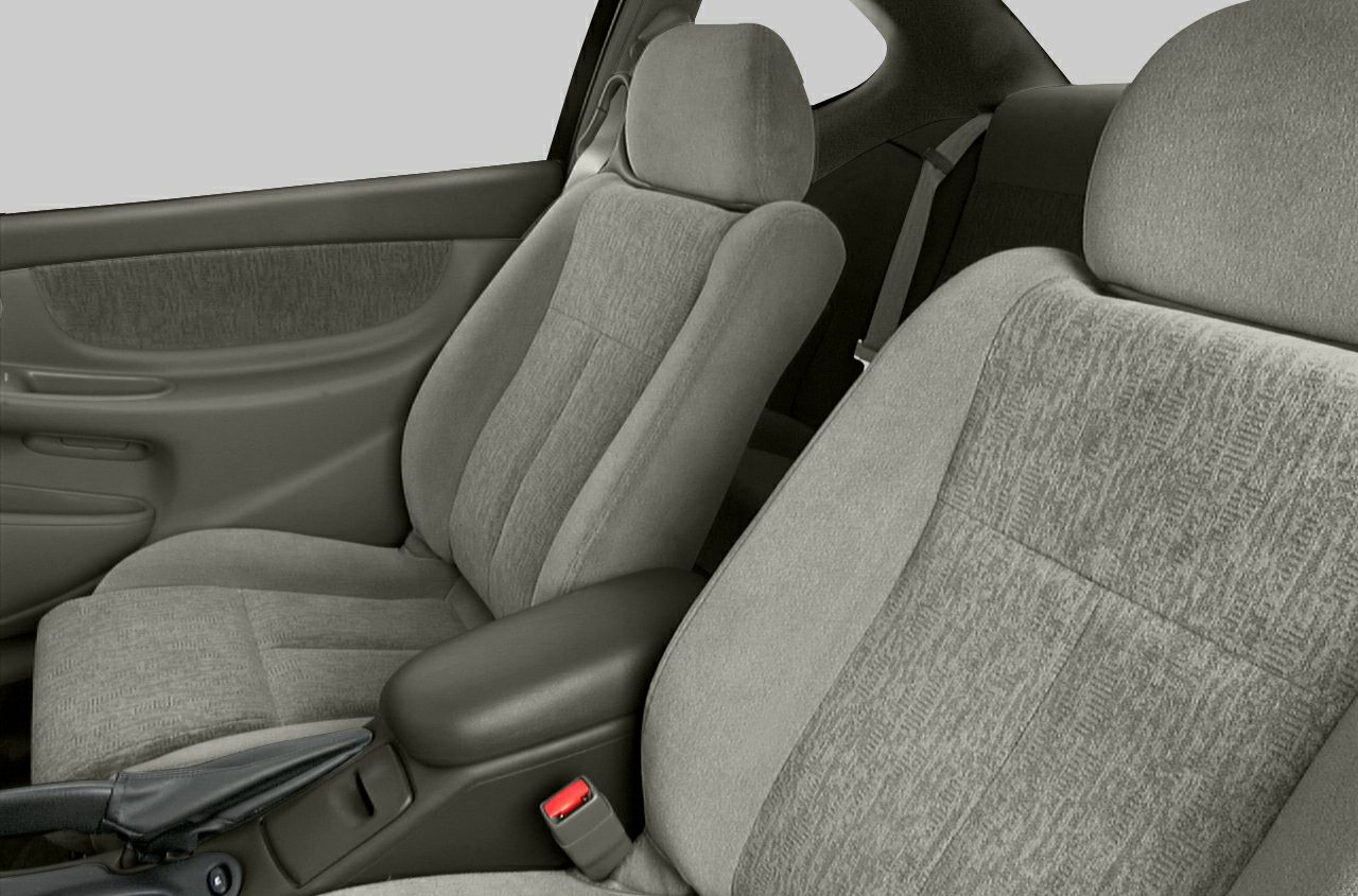 Front seats and door panel with fabric upholstery and seatbelt