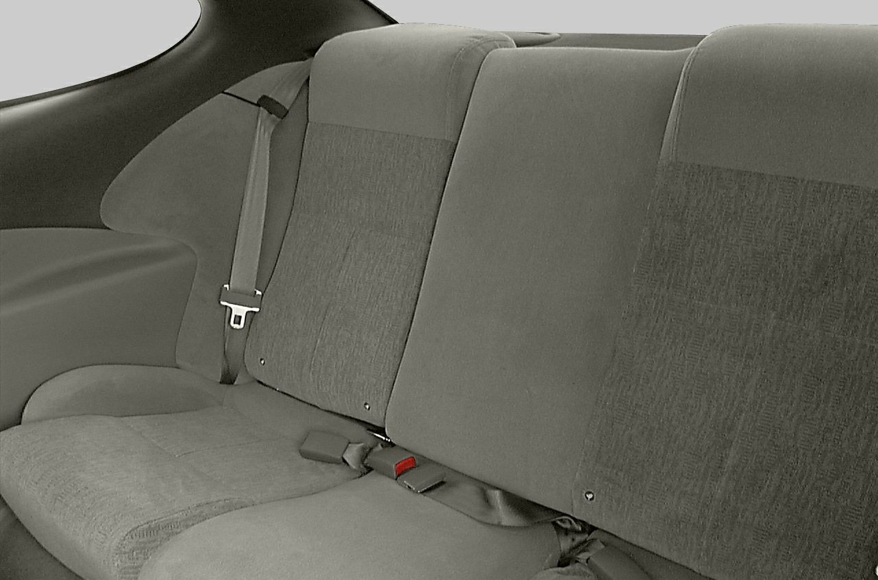 Rear seat upholstery with seat belts in a coupe