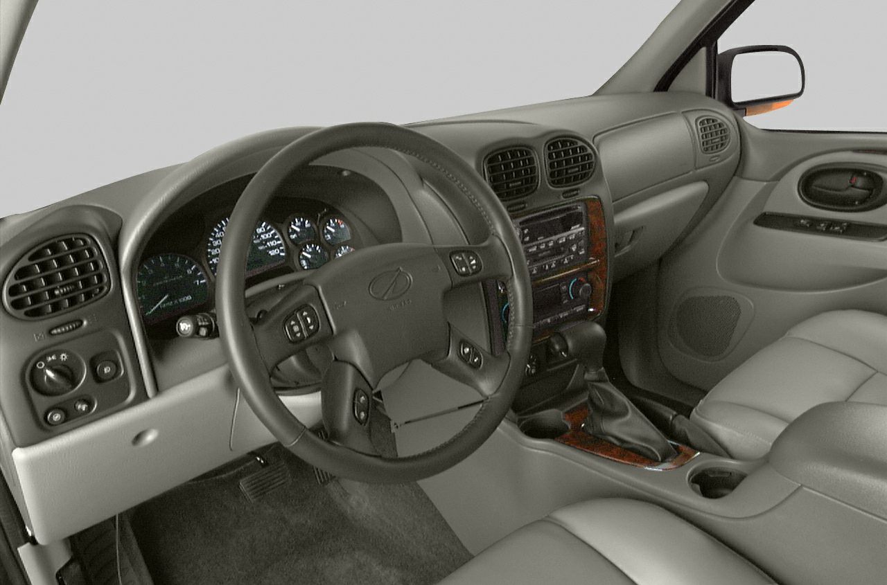 Dashboard and steering wheel with wood trim and center console