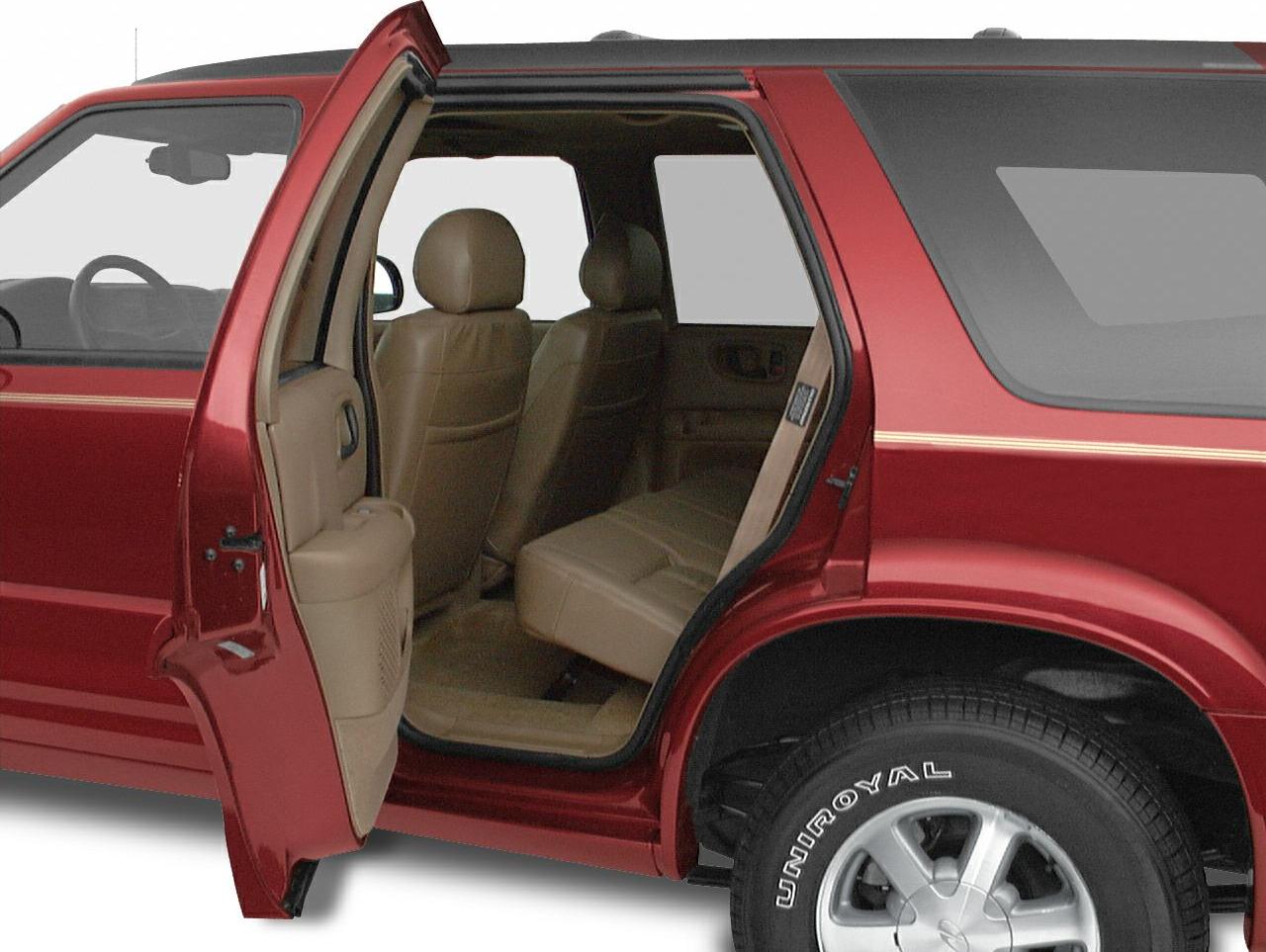 Interior rear door and brown leather rear seats of SUV