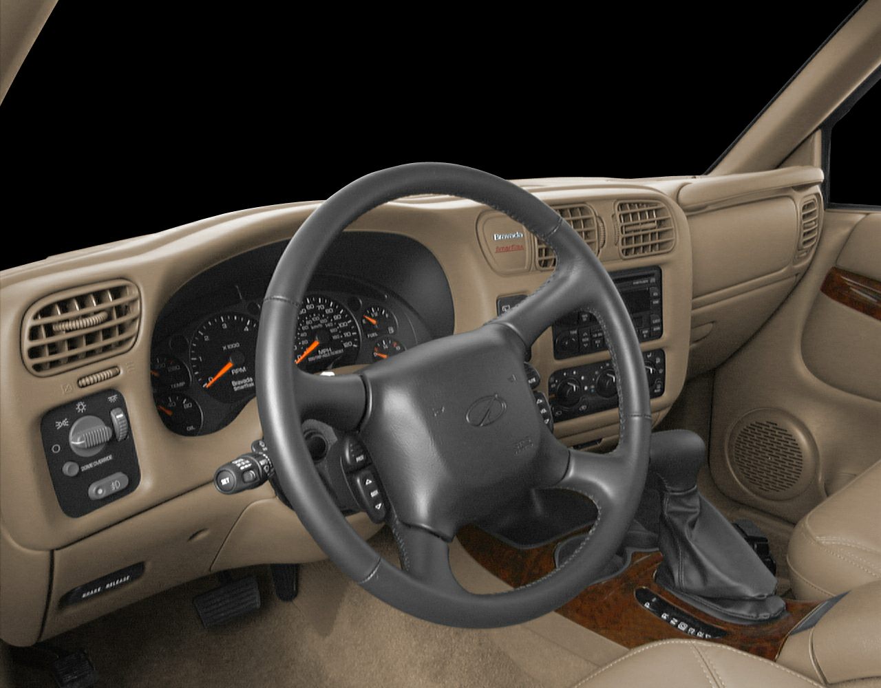 Car dashboard, steering wheel, and center console in beige interior