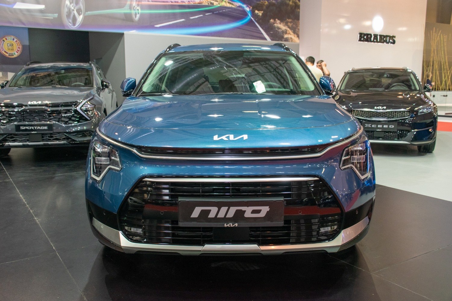 Front view with distinctive LED headlights and large grille.