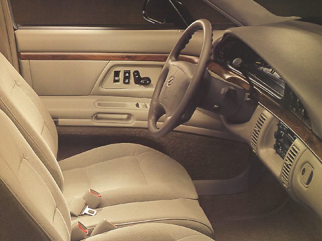 Beige fabric seats and steering wheel with dashboard and door controls