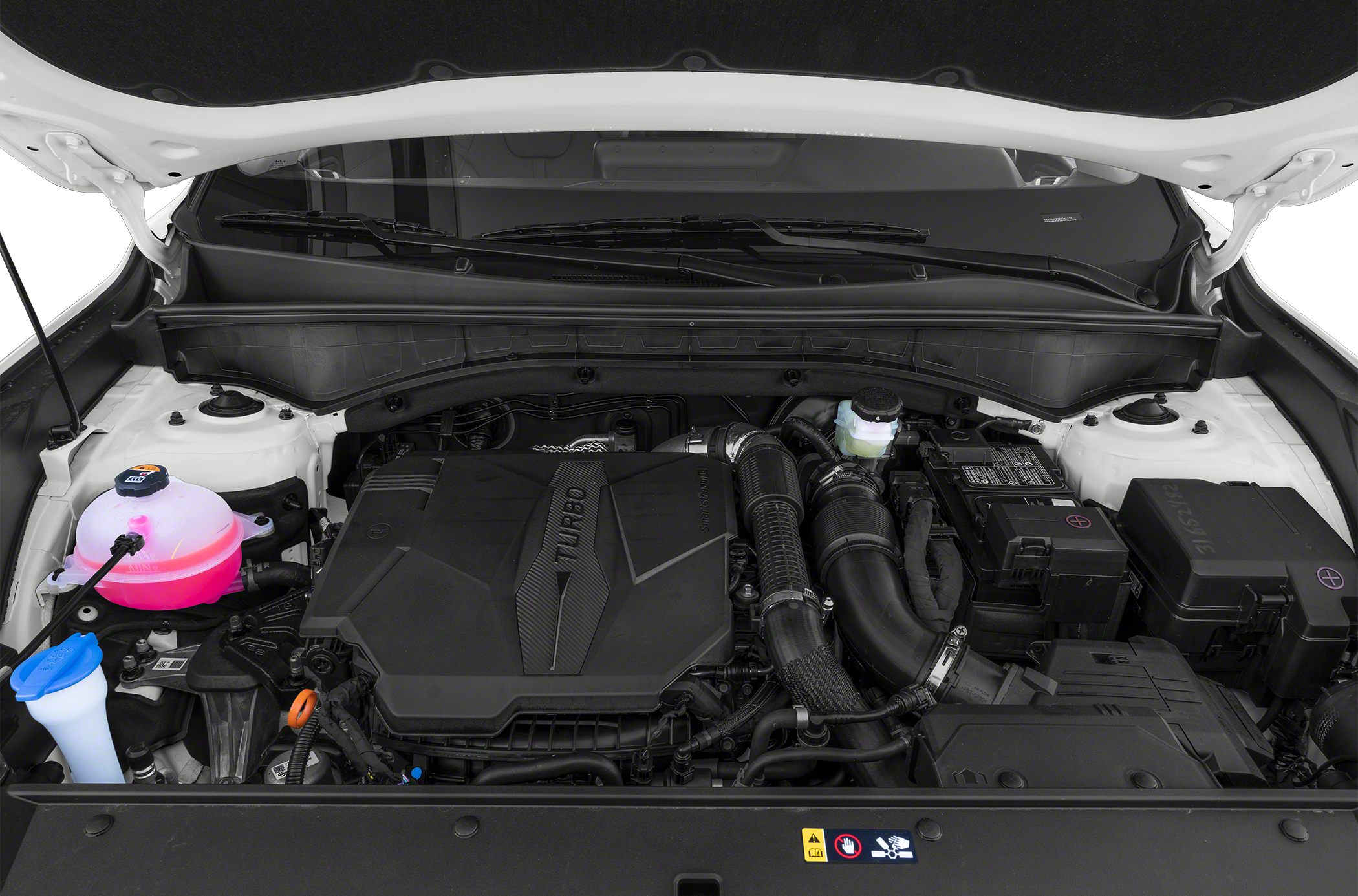 Turbocharged engine in a modern SUV engine bay with visible components