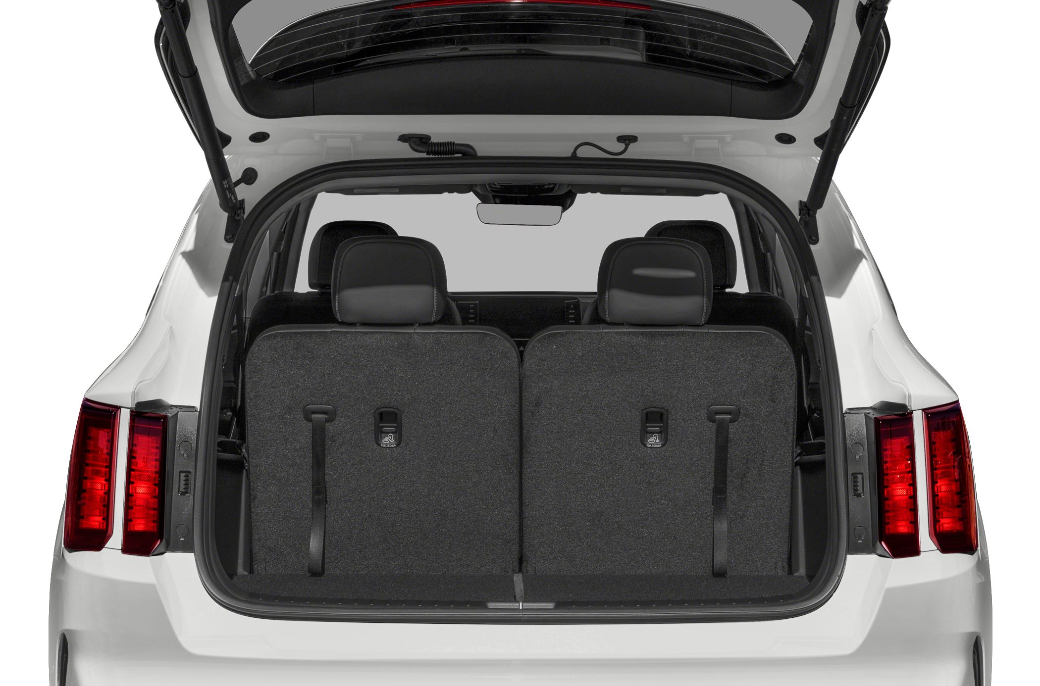 Trunk interior with rear seats in upright position and open tailgate