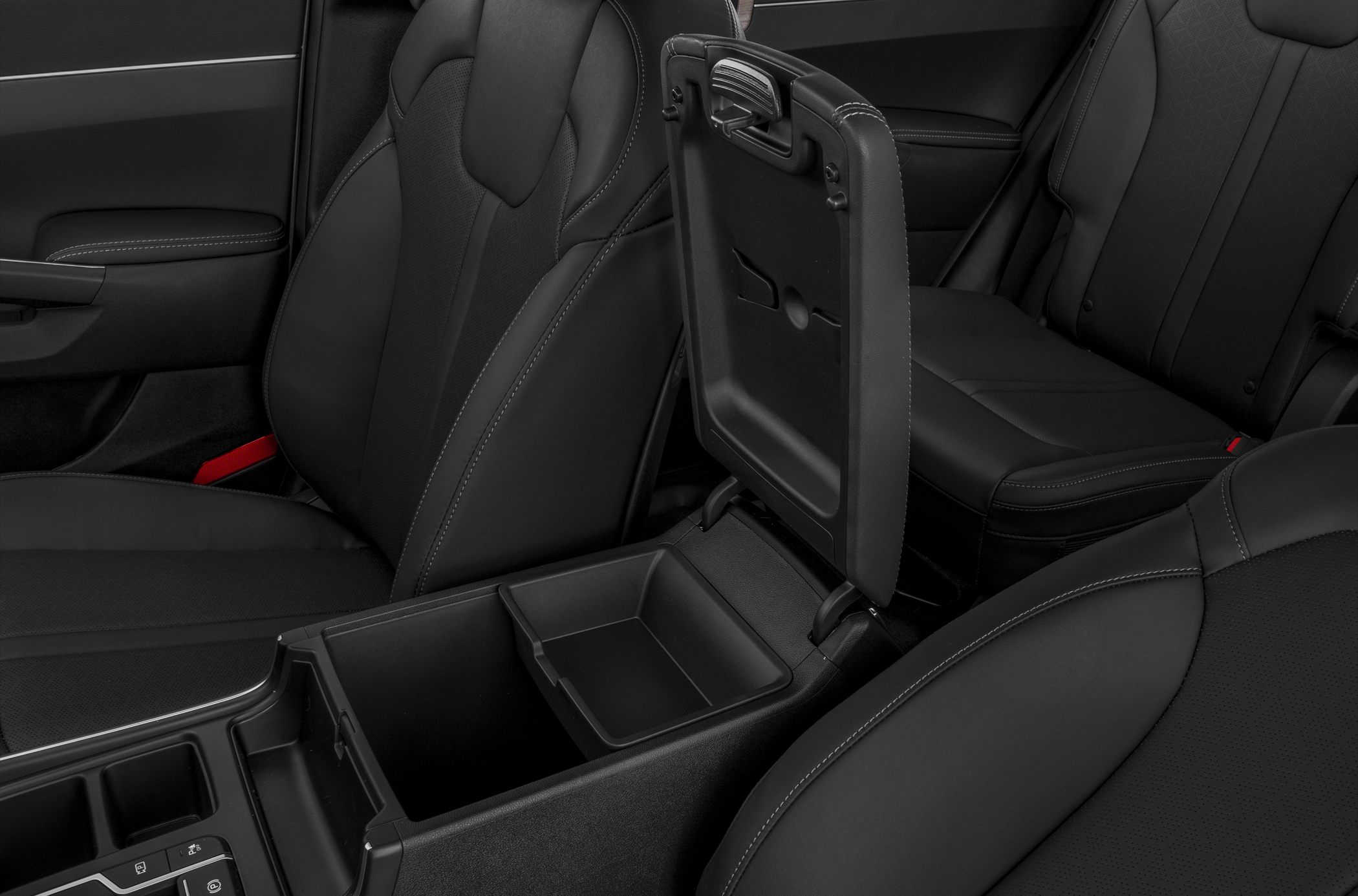Black leather seats with open center console storage and cupholders