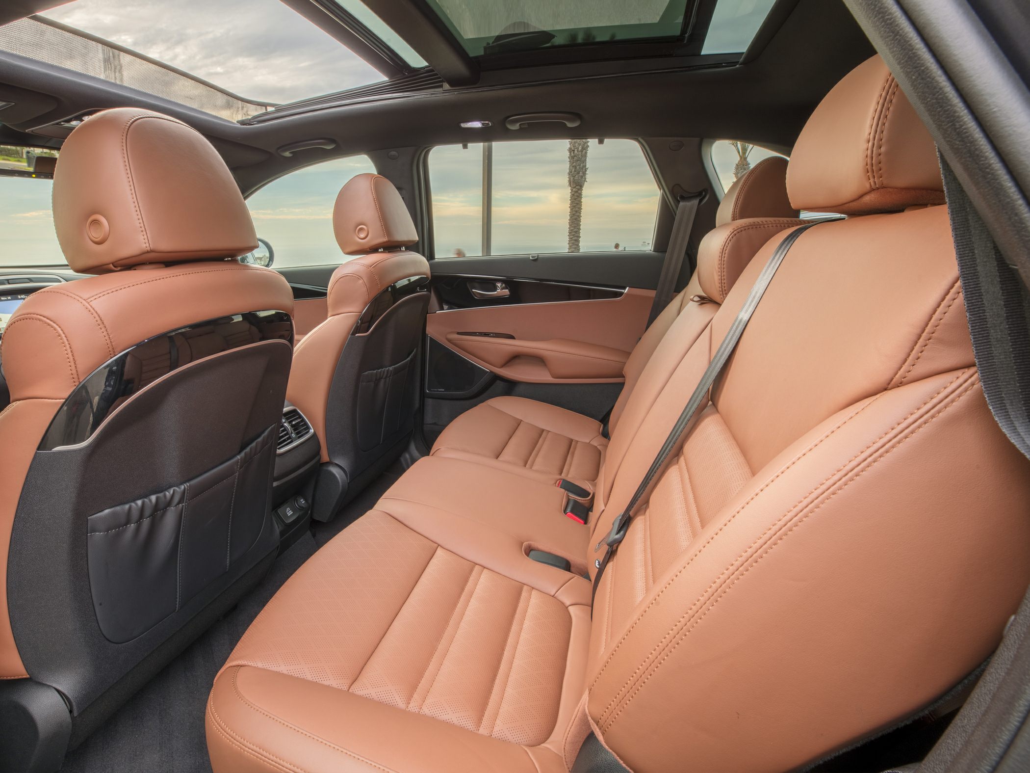 Brown leather rear seats with panoramic sunroof and seatback pockets