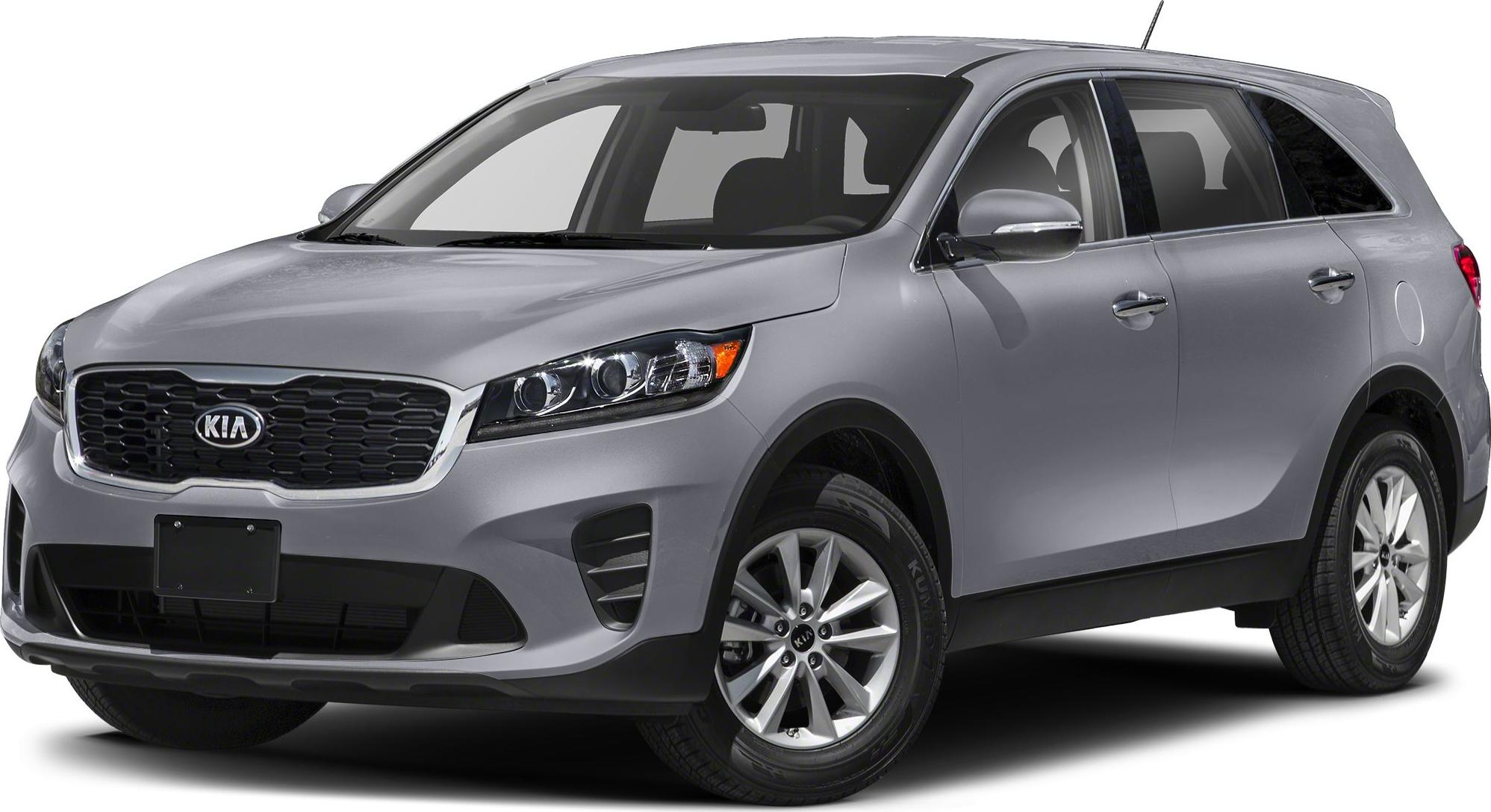 Front-side view of silver SUV with distinctive grille and headlights