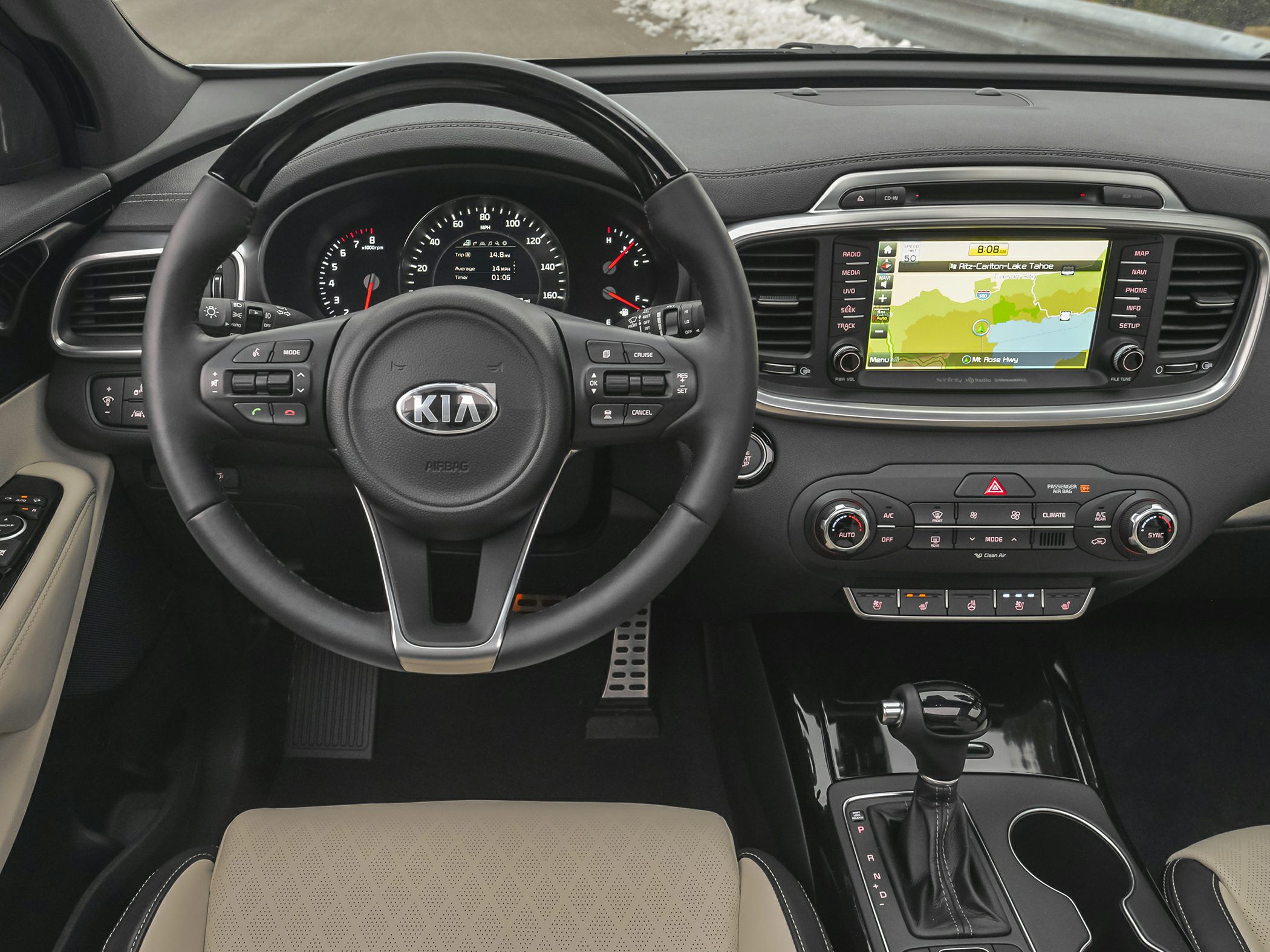 Dashboard, steering wheel, infotainment system and gear shift of a modern SUV interior