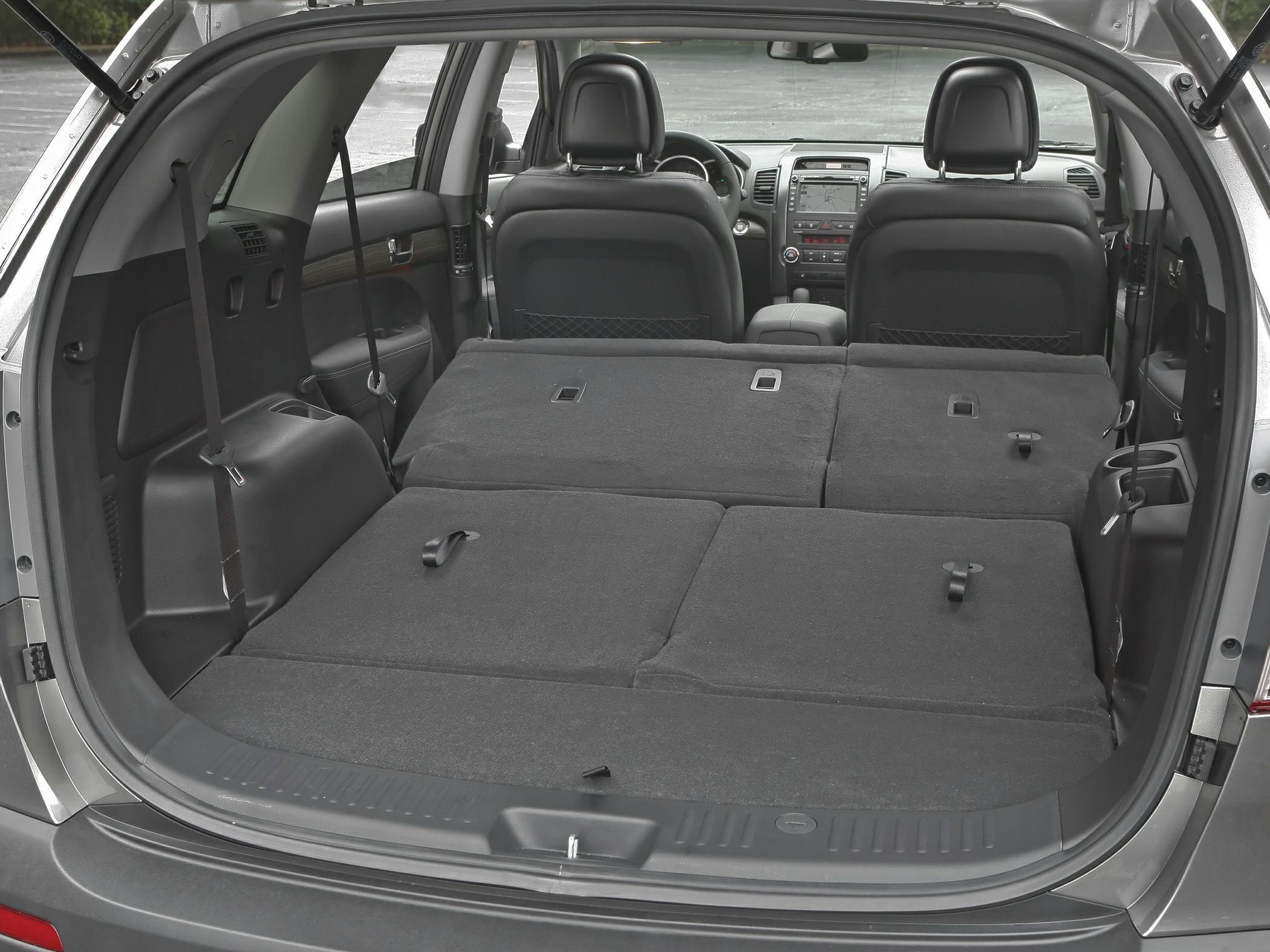 Folded rear seats showcasing spacious cargo area inside an SUV.