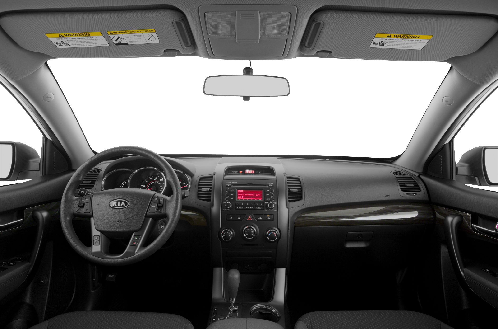 Steering wheel and dashboard interior view with controls and wood trim