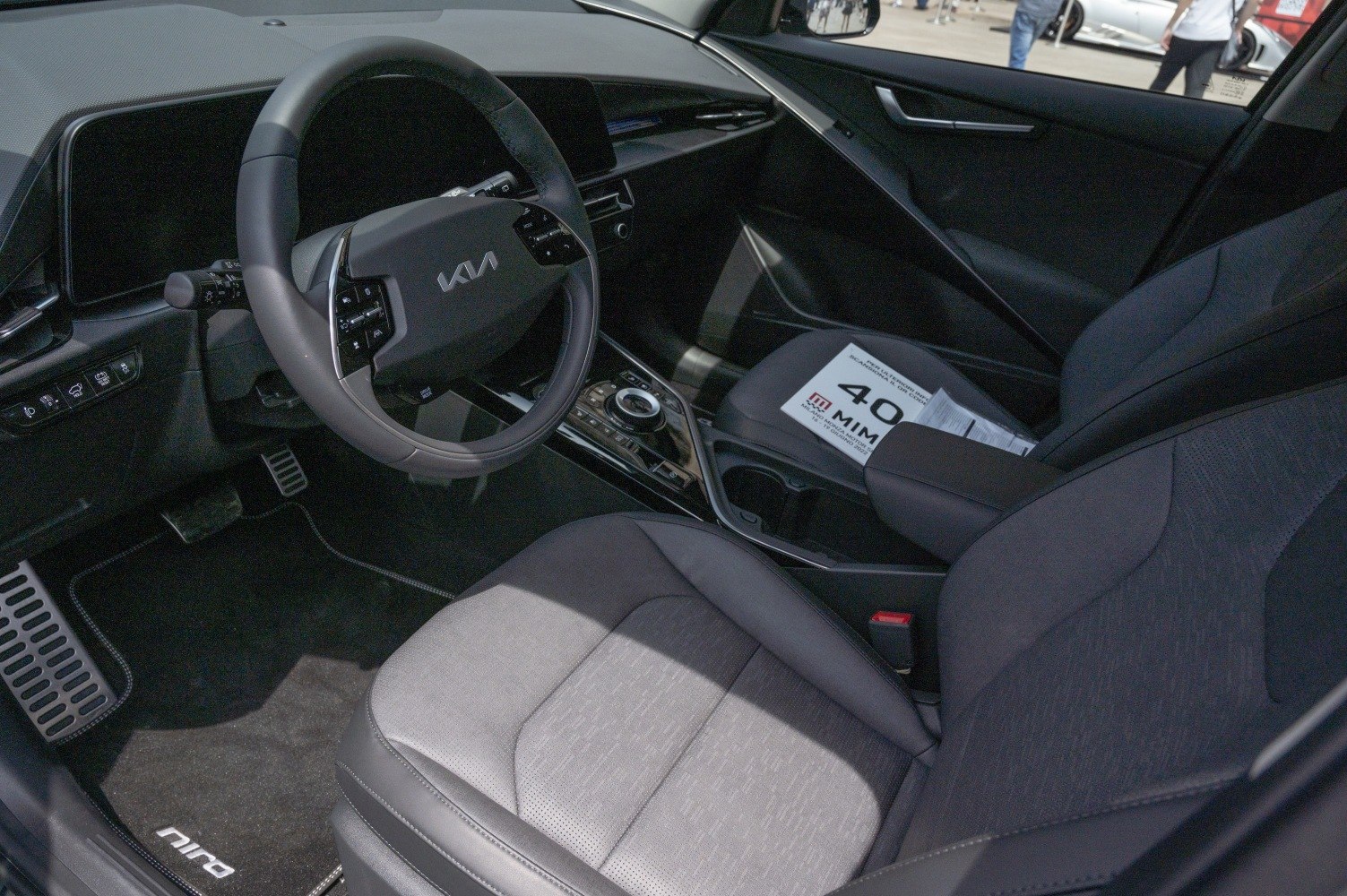 Modern car interior with multifunctional steering wheel and digital dashboard