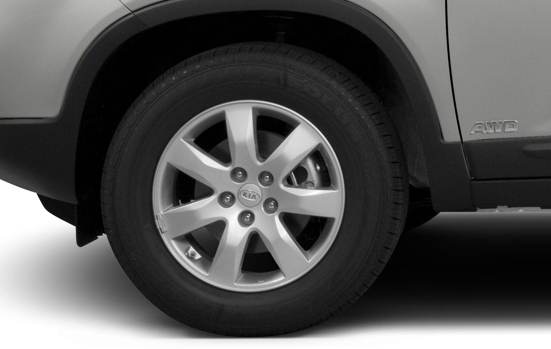 Alloy wheel and AWD badge on SUV side panel