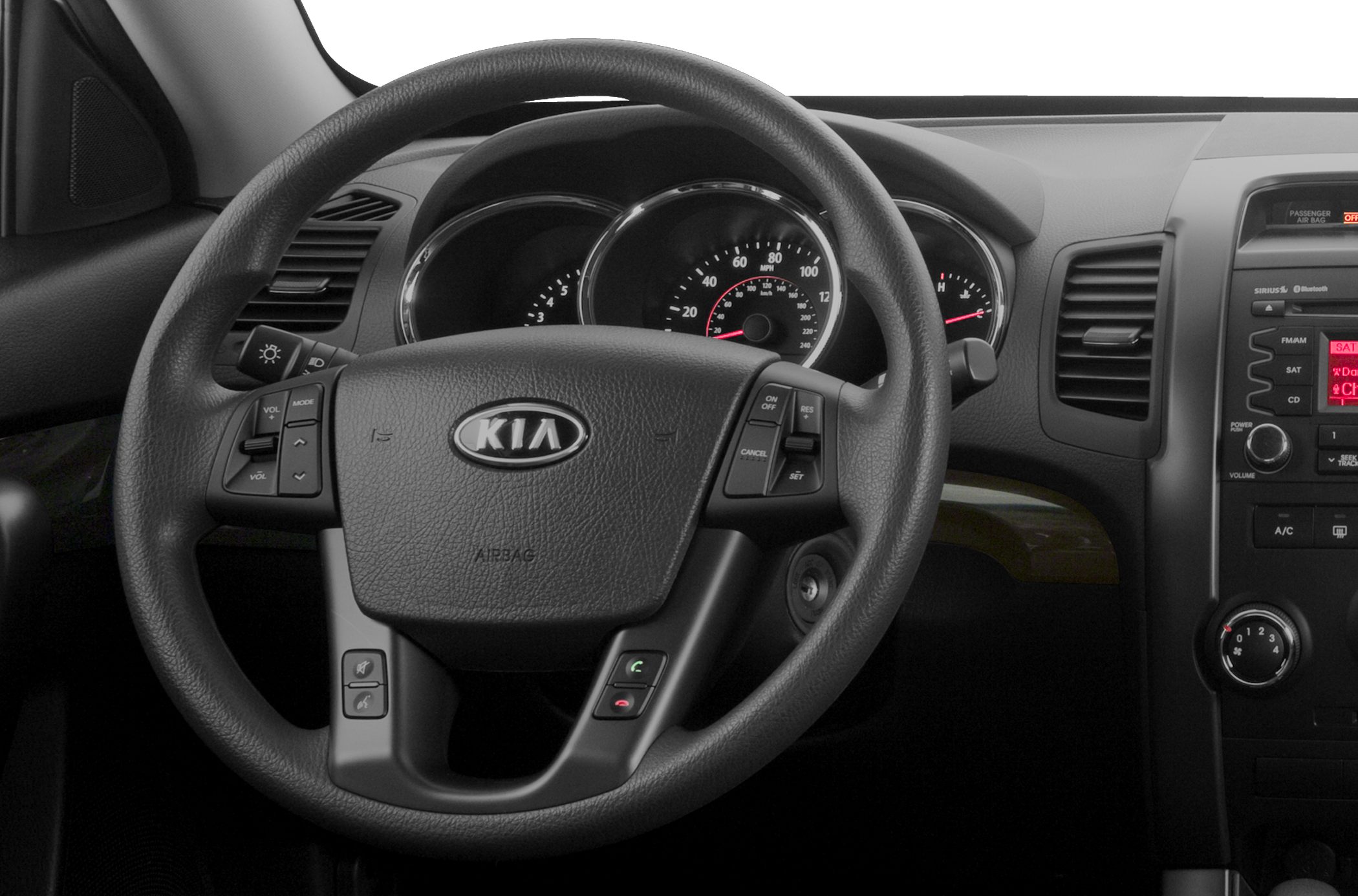 Steering wheel with control buttons and dashboard instrument cluster