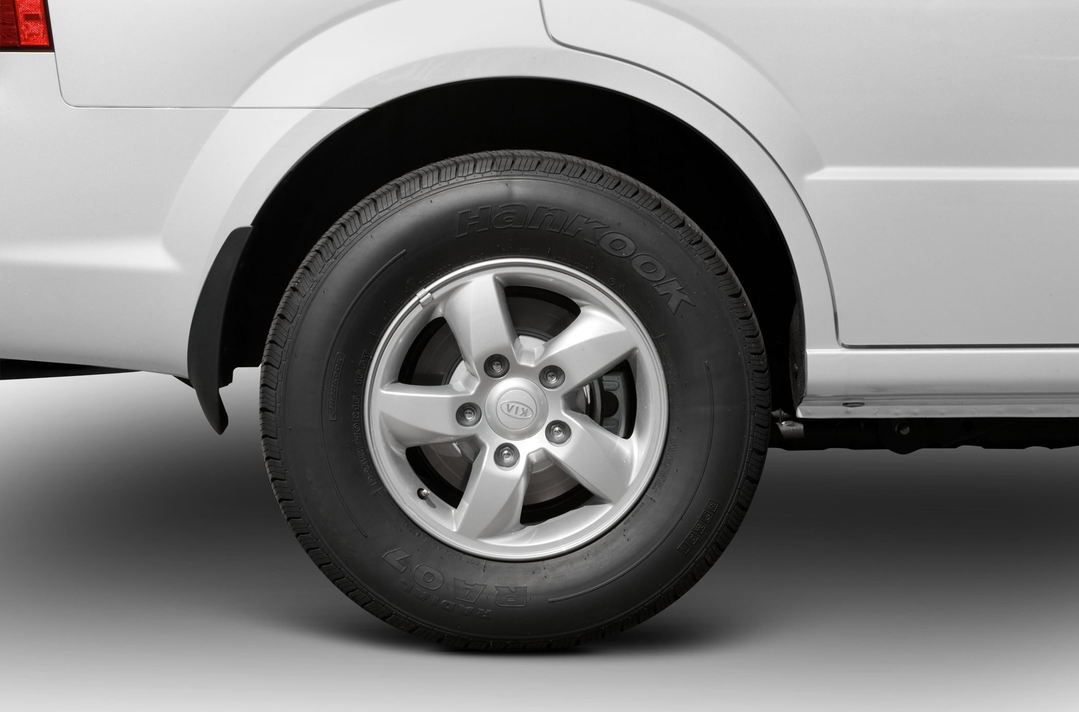 Close-up of alloy wheel and Hankook tire on car rear side