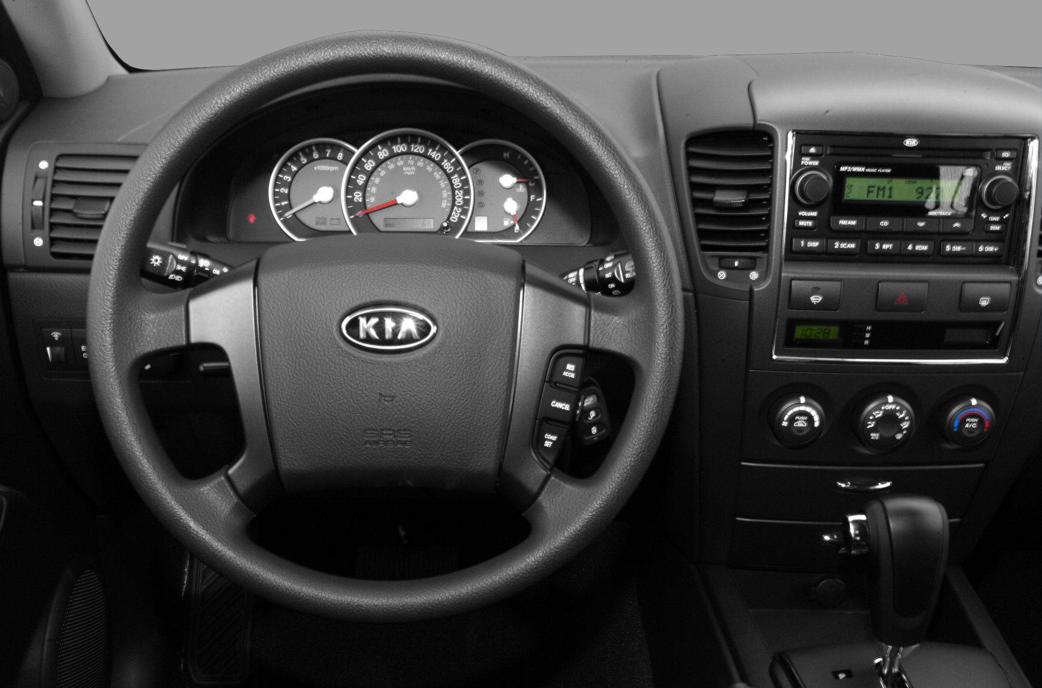 Dashboard with steering wheel, instrument cluster, and center console controls