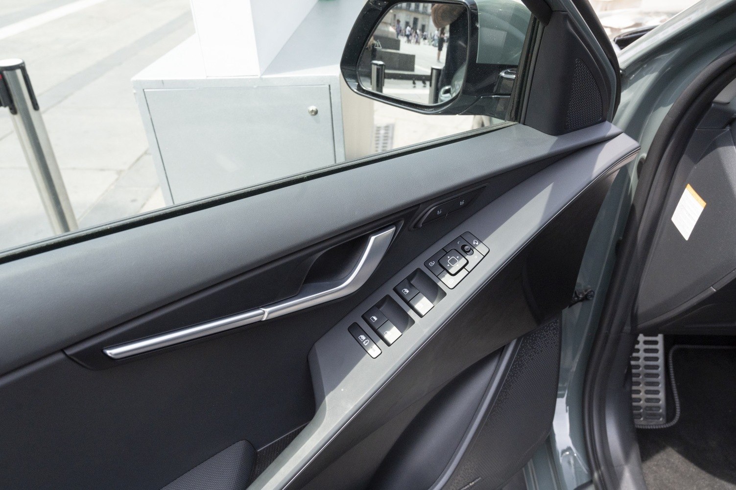 Interior door panel with window and side mirror controls