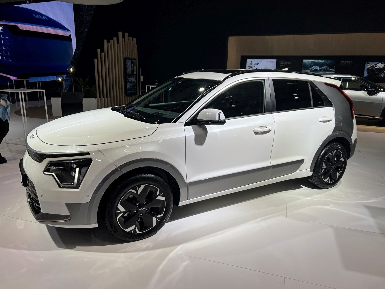 White subcompact crossover with angular LED headlights and black roof.