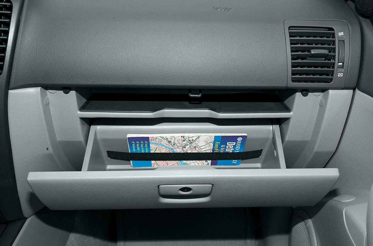 Open glove compartment with map holder and dashboard air vent