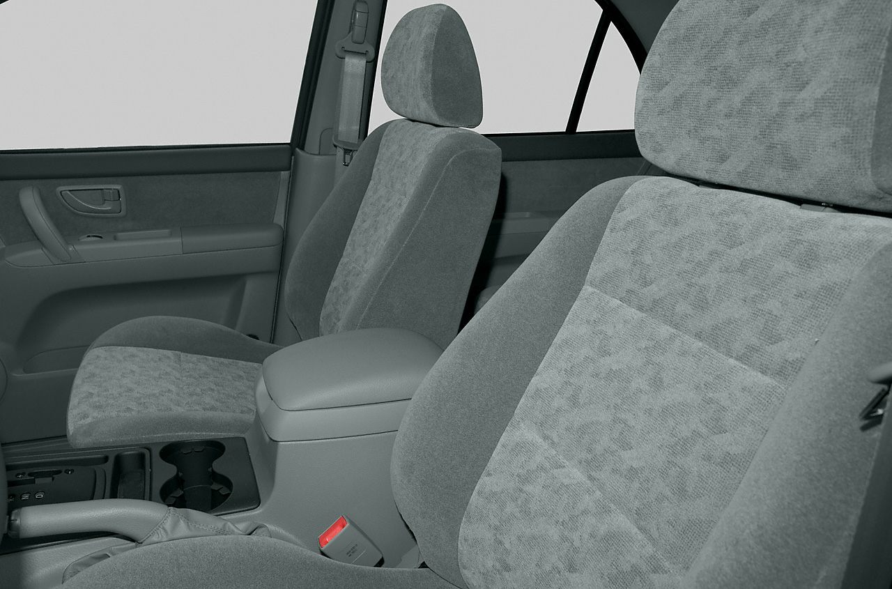 Front fabric seats and center console with cup holders and armrest