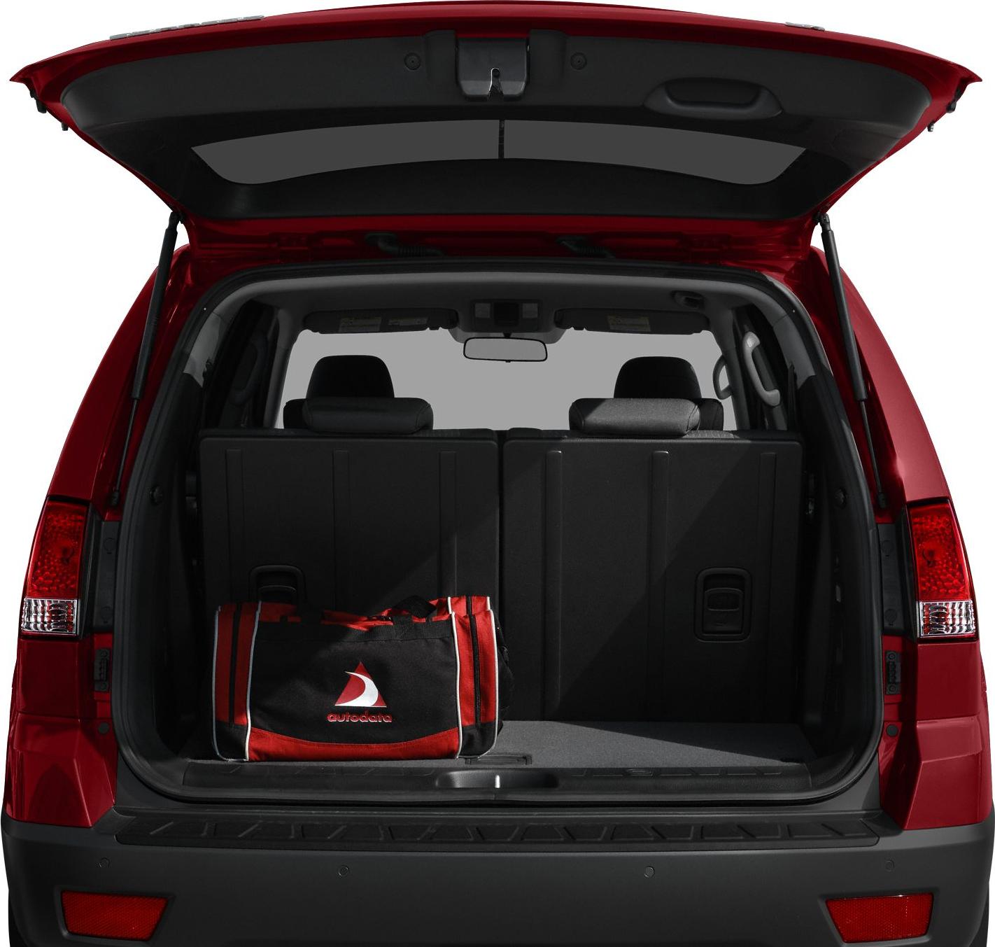 Spacious open rear cargo area with tailgate raised and luggage inside