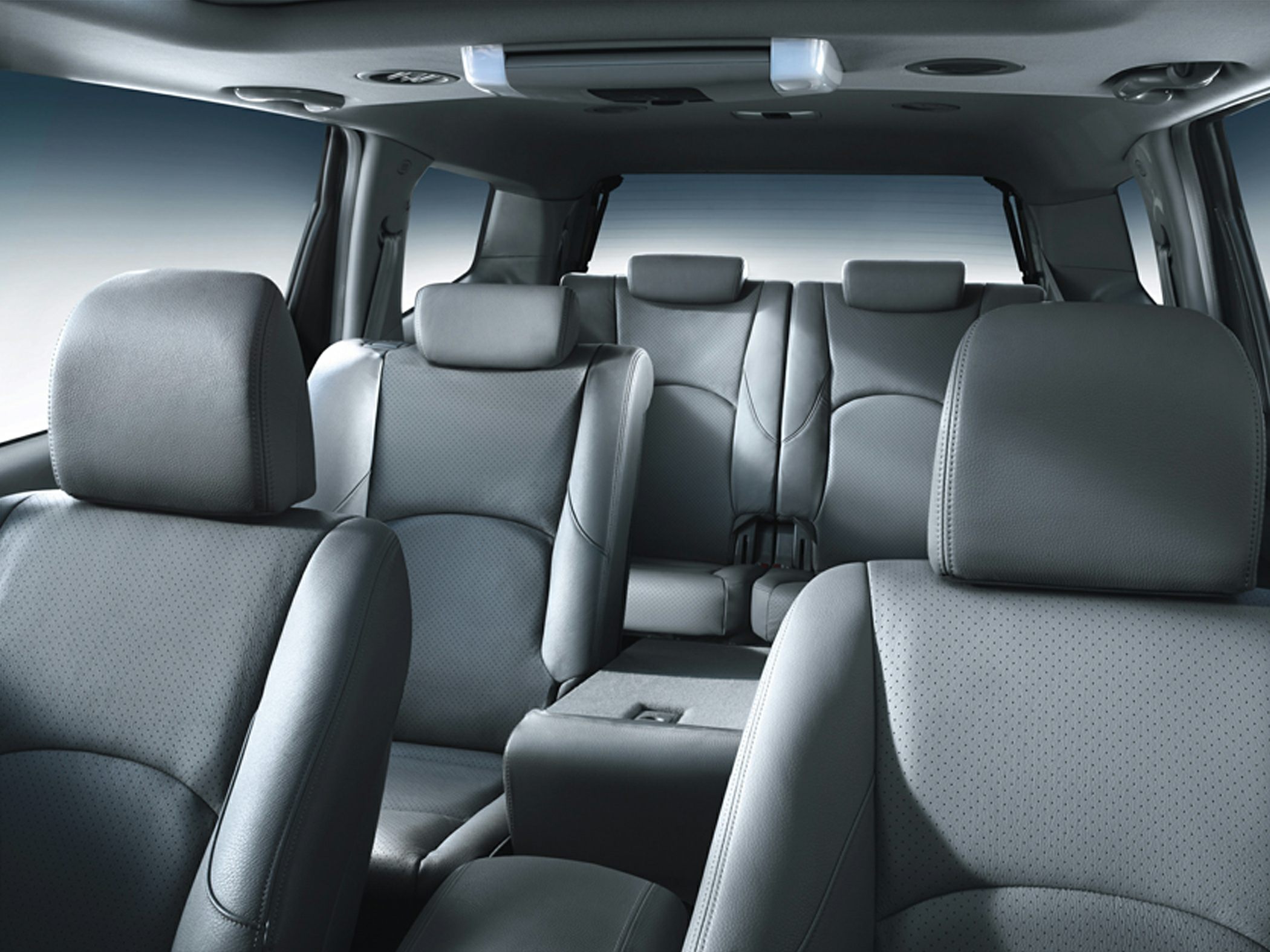 Spacious multi-row leather seats with headrests in an SUV interior