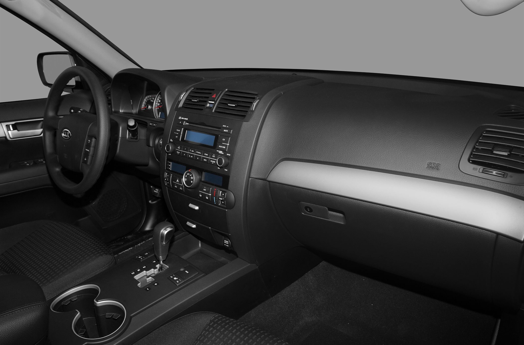 Car dashboard, steering wheel, center console with gearshift