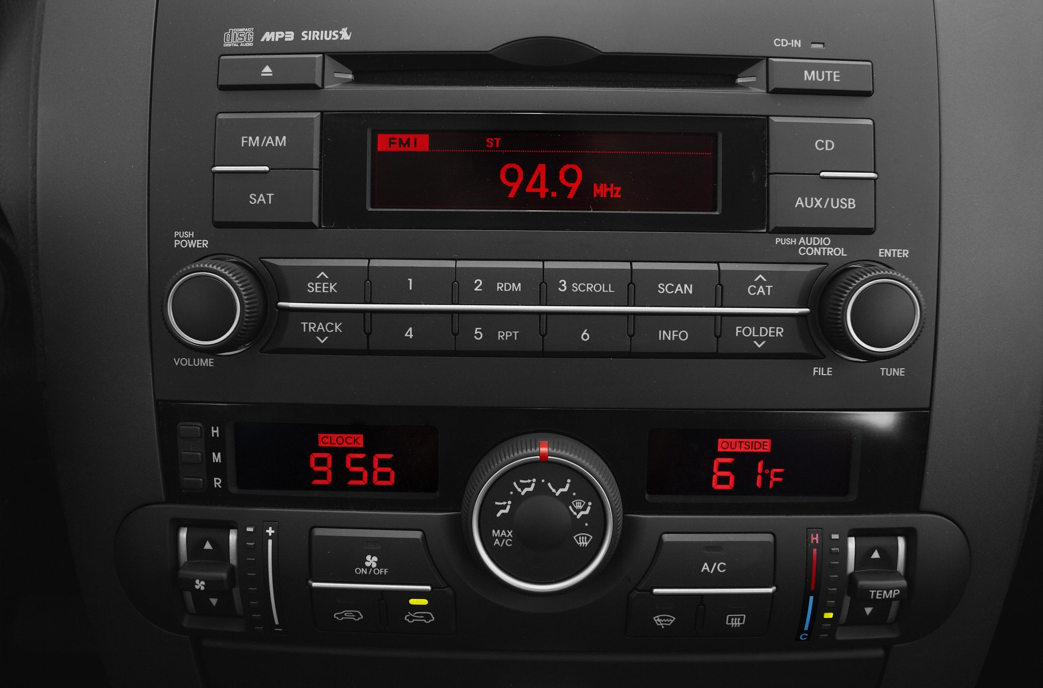 Car audio system with FM radio and climate control panel with temperature and fan settings