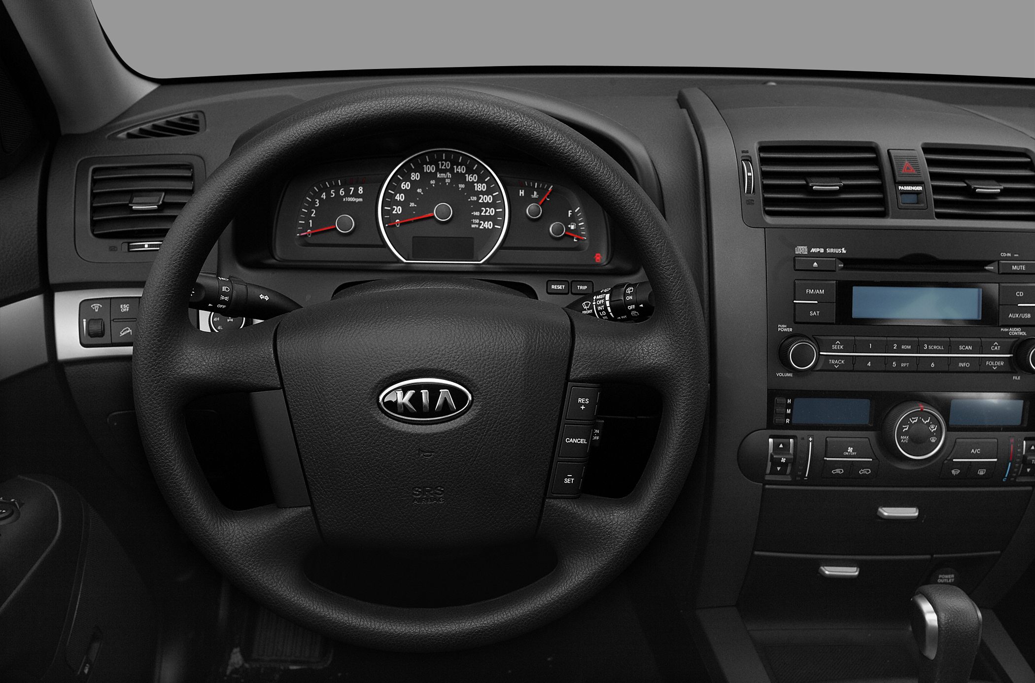 Dashboard and steering wheel with instrument cluster and control buttons