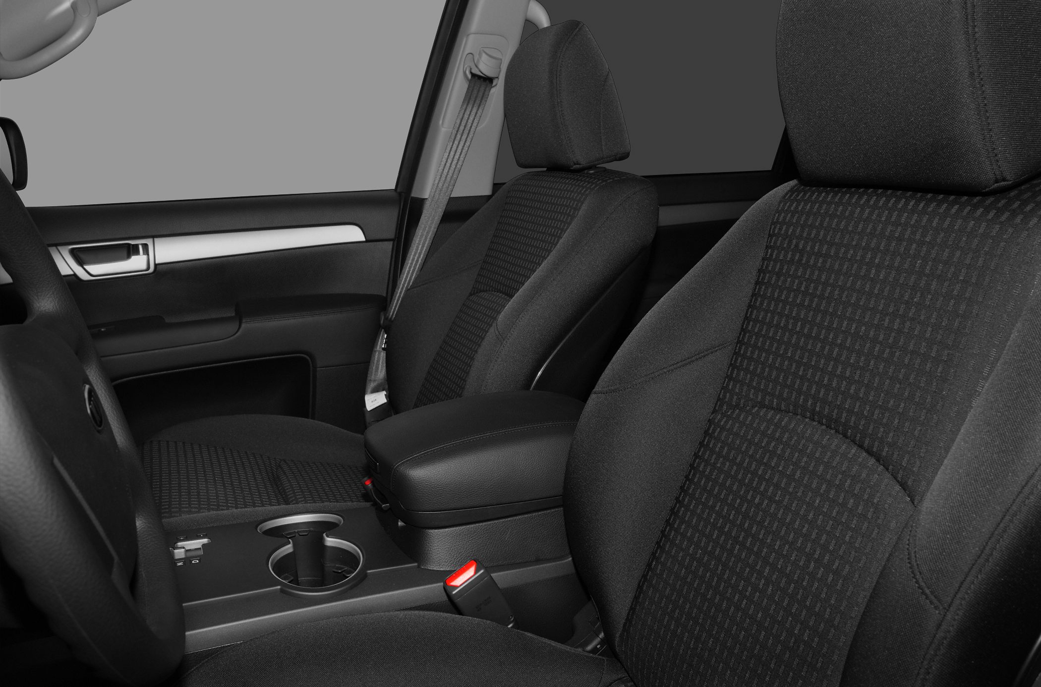 Front seats with patterned fabric and center console with cup holders and armrest
