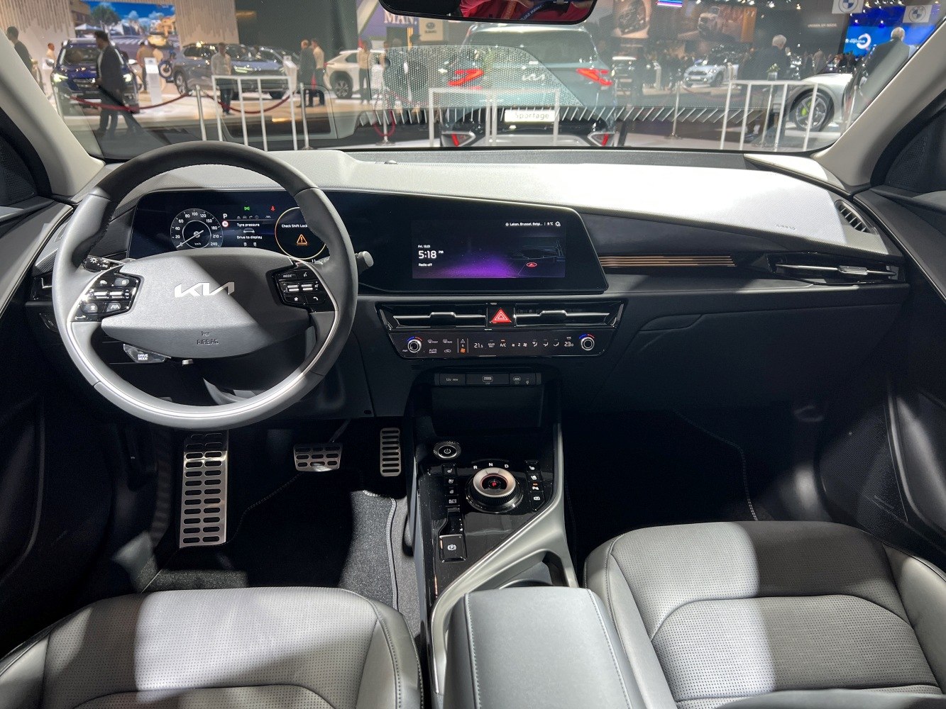Digital instrument cluster and large central touchscreen infotainment display.