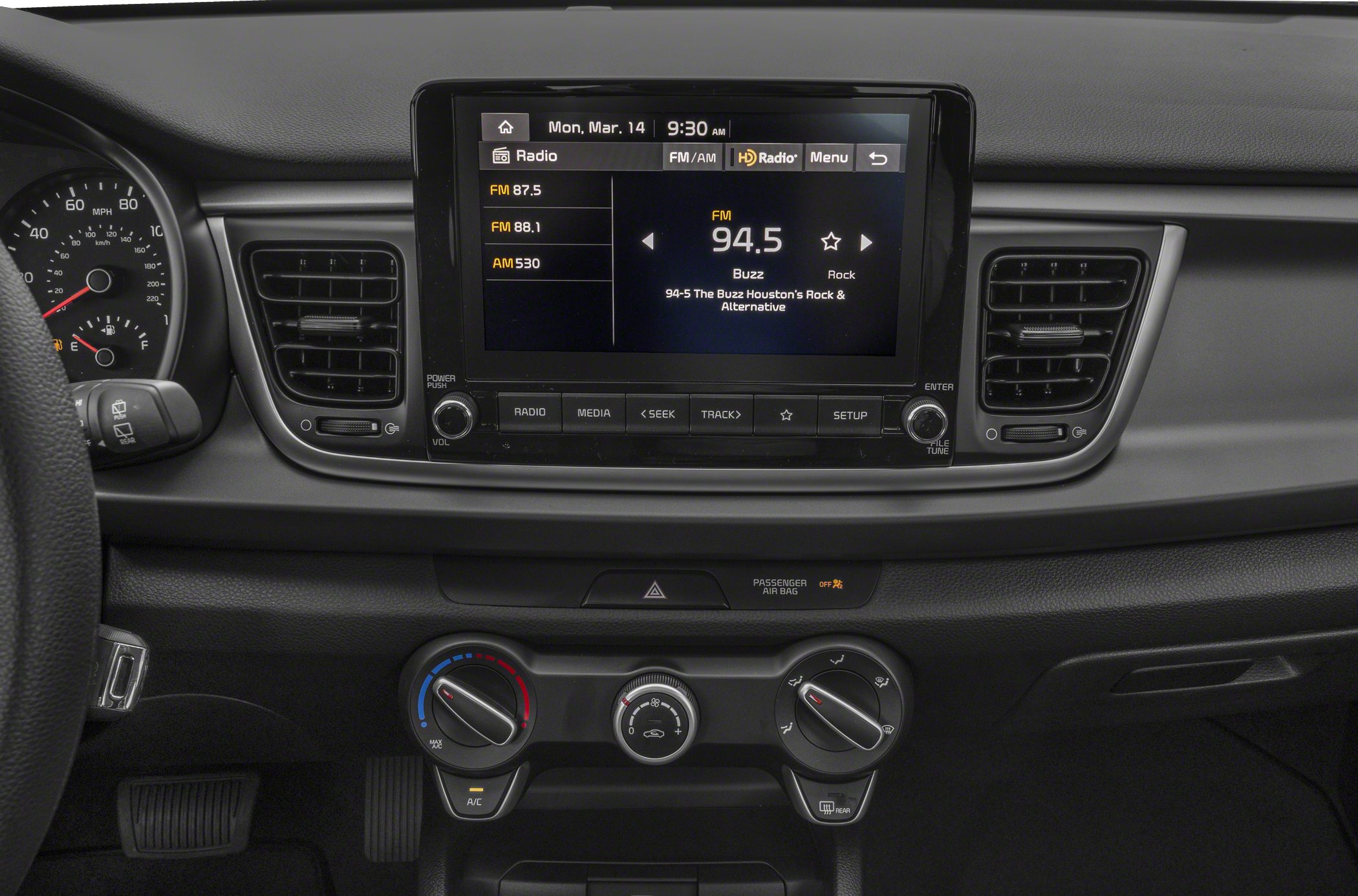 Center console with infotainment screen and climate control dials
