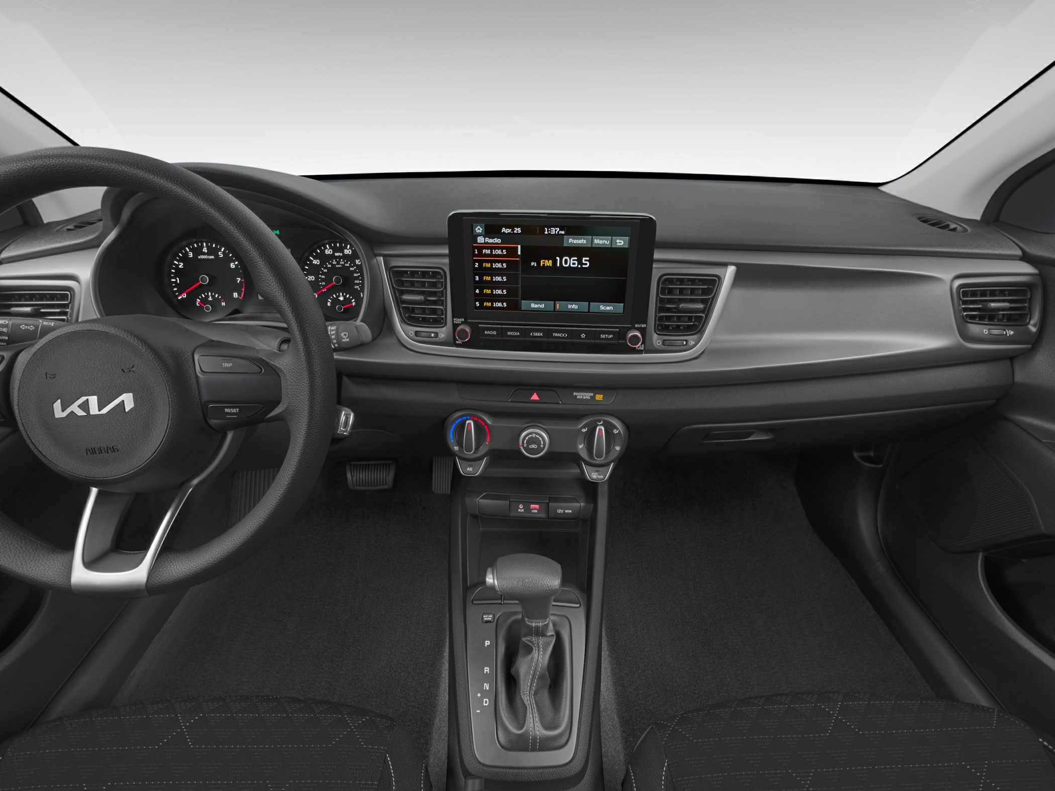 Dashboard, steering wheel, infotainment, and climate controls of a sedan interior