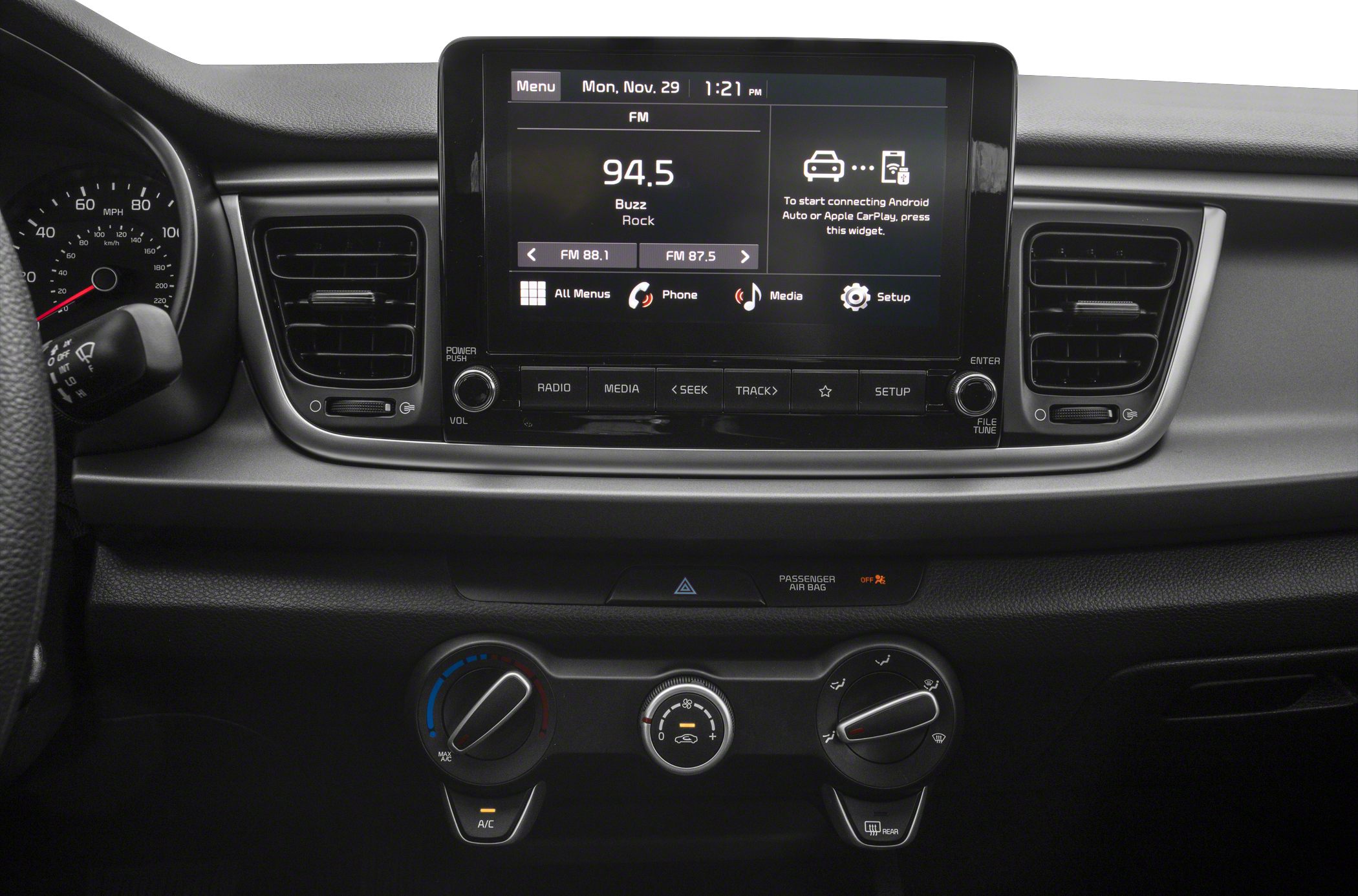 Touchscreen infotainment system with manual climate controls on dashboard