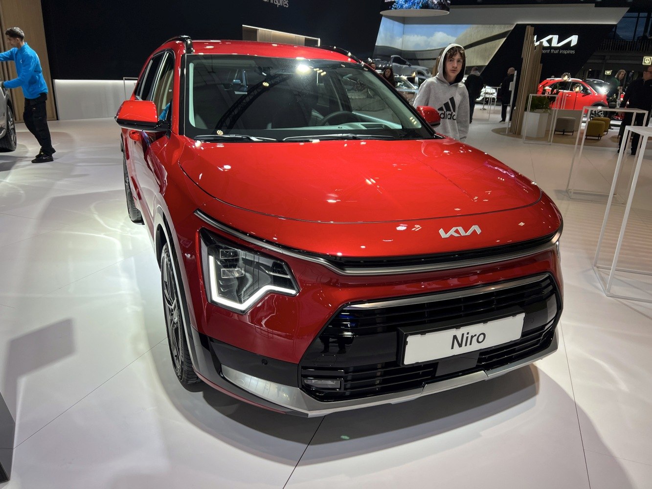 Front view of a red SUV with LED headlights and prominent grille