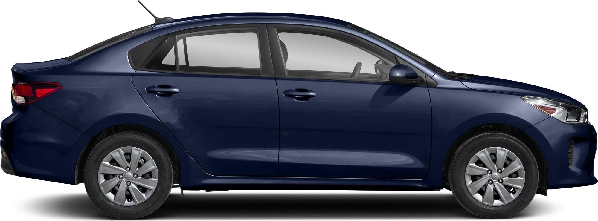 Side profile of a compact sedan with alloy wheels